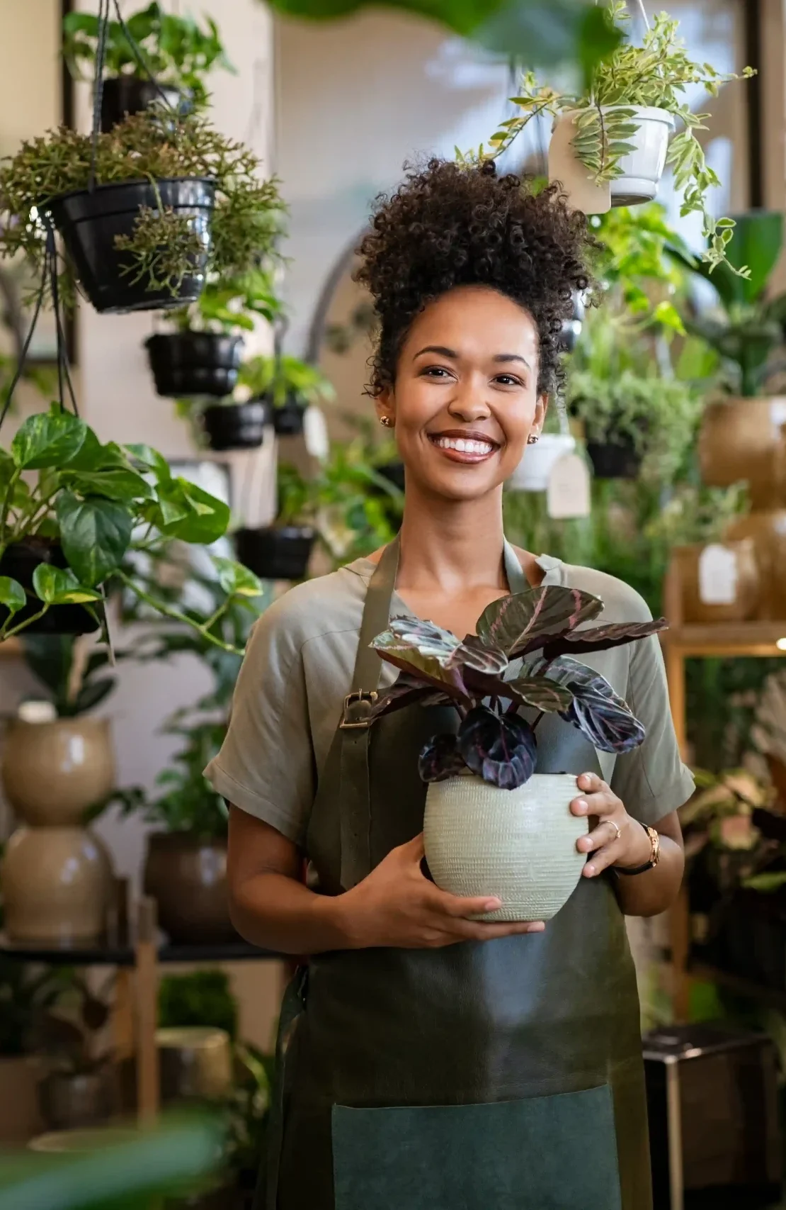 small business owner smiling in her plant shop 2026 03 17 07 23 41 utc
