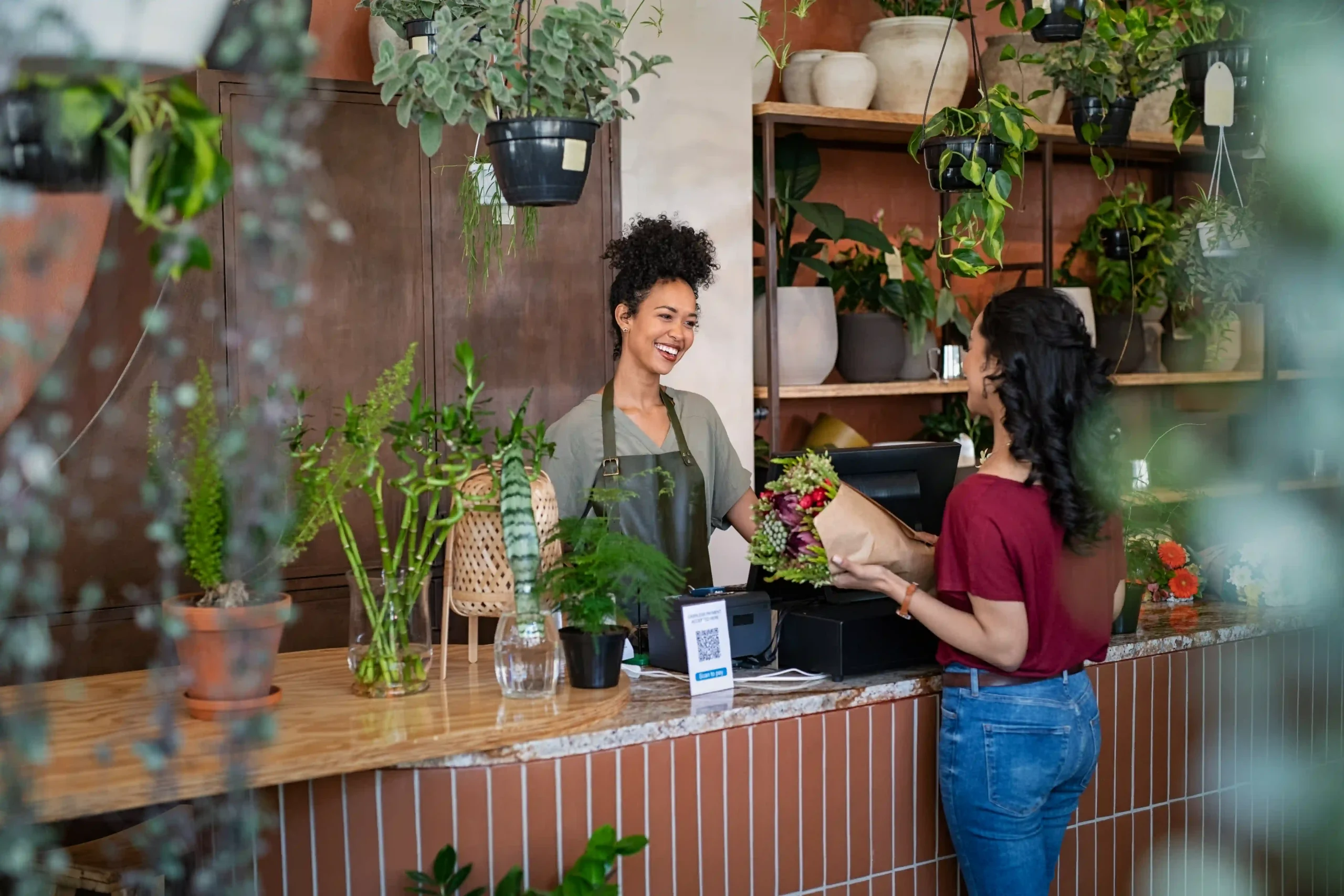 woman buying flowers at a flower shop 2026 03 17 04 23 04 utc (1)